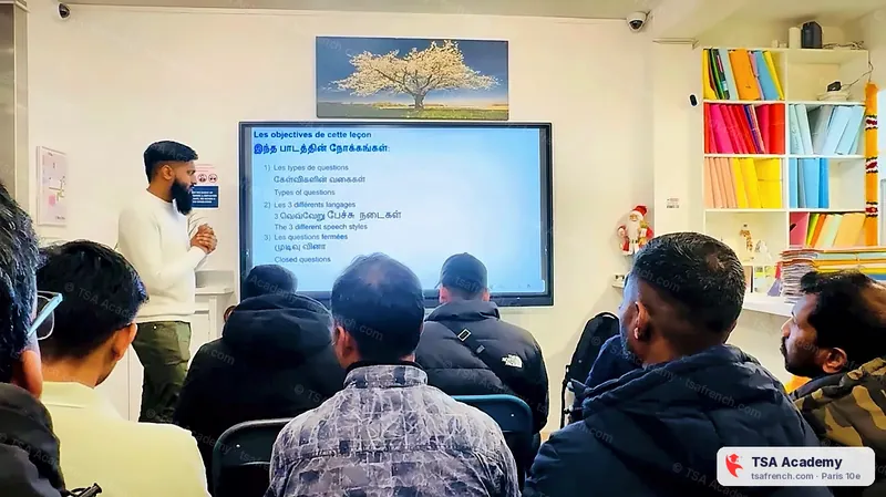 Moïse explains the lesson in French, Tamil and English